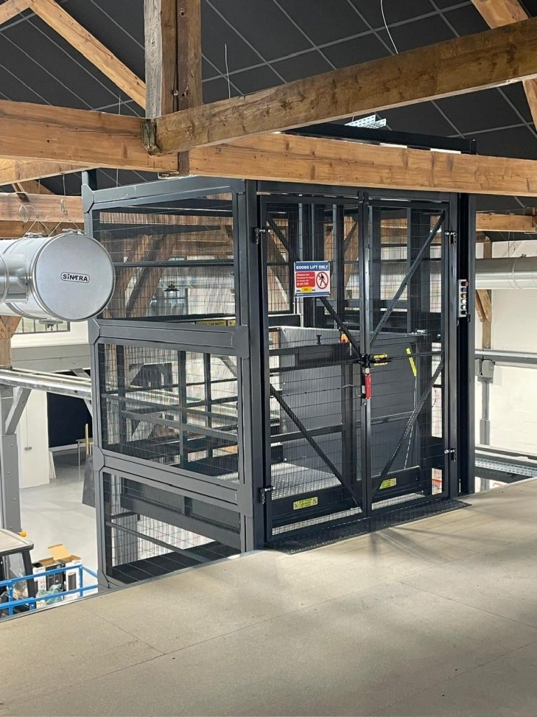 Mezzanine lift installed in a warehouse on a mezzanine floor